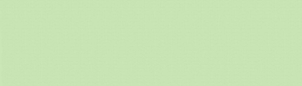 A light green background with some white dots